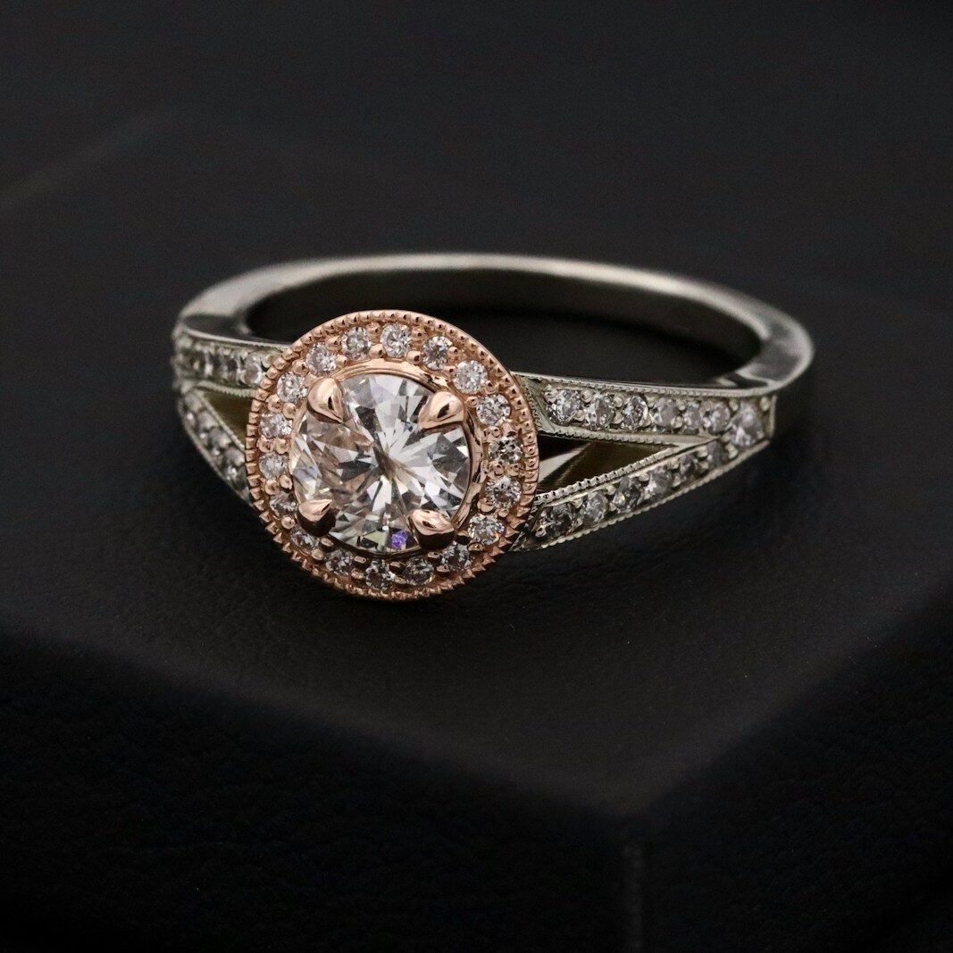 silver diamond ring on black box