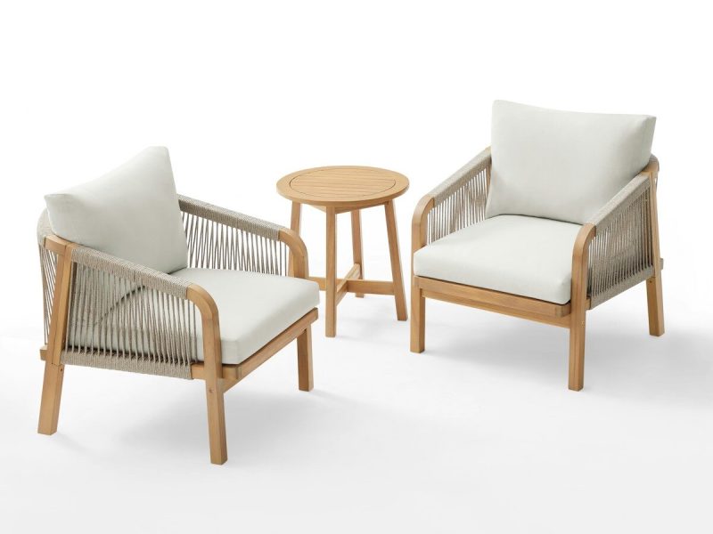 Two chairs and a small table on white background